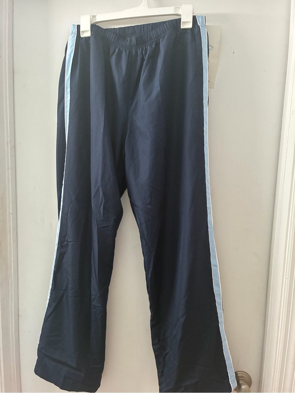 Navy Track Pants with Light Blue Side Stripes.